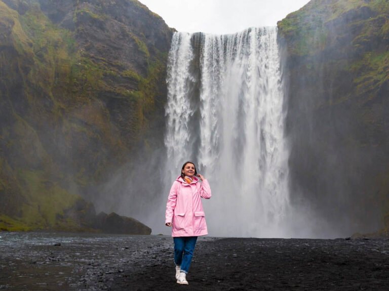 A-visitor-at-Skogafoss-waterfall-in-South-Iceland_edited